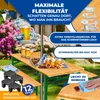 A beer tent set with benches and a table in an outdoor setting, decorated with Bavarian motifs and featuring drinks and pretzels. Produktbild-Vorschau
