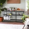 A console table with decorative items and books on display. Produktbild-Vorschau
