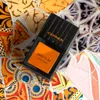 A perfume bottle is placed on a colorful mosaic surface. Anteprima dell’immagine prodotto