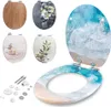 A collection of toilet seats with different designs, including a wood grain, a stone and orchid design, a zen garden design, a branch and stones design, and a wave and beach design. Also includes installation hardware. Produktbild-Vorschau