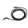 A black audio cable with two 3.5mm jack connectors, one straight and one angled, coiled on a white background. Náhled obrázku produktu