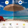 A beach scene with a large straw umbrella, a beach chair, and the ocean in the background. Podgląd zdjęcia produktu