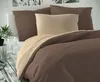 A close-up view of a bed with brown and beige bedding. Produktbild-Vorschau