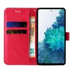 A red flip phone case is open, revealing card slots and a banknote. The phone is displayed on the right side of the case. Produktbild-Vorschau