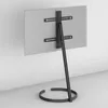 A rear view of a television stand with a flat-screen TV mounted on it, placed against a wall. Náhled obrázku produktu
