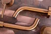 Close-up view of copper-colored faucets and fixtures on a textured background. Anteprima dell’immagine prodotto