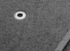 A close-up view of a gray car floor mat with a white grommet. Produktbild-Vorschau