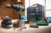A collection of power tools and accessories laid out on a wooden surface, likely a workbench. Produktbild-Vorschau