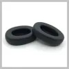 Two black ear pads for headphones are shown on a white and light gray background. Produktbild-Vorschau