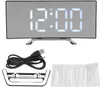 A digital alarm clock with a curved mirror display, along with its accessories, is laid out on a white background. Produktbild-Vorschau