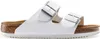 A side view of a white Birkenstock Arizona sandal with silver buckles. Náhľad obrázku produktu
