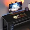 A gaming computer desk setup with a monitor, keyboard, mouse, and RGB lighting. Produktbild-Vorschau