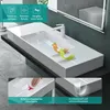 A modern white washbasin with a white faucet, set against a dark gray wall and reflected in a mirror. Produktbild-Vorschau