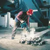 A construction worker using a jackhammer to break concrete. Produktbild-Vorschau