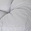 A close-up view of a light gray tufted cushion, likely a dog mattress, showing the texture of the fabric and the stitching. Náhled obrázku produktu