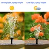 A split image showing a solar-powered fountain pump operating in strong light on the left and low light on the right, with flowers in the background. Náhled obrázku produktu
