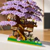 A detailed model of a treehouse with purple blossoms, built from construction blocks. Náhľad obrázku produktu