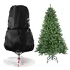 A Christmas tree bag and a Christmas tree are shown side-by-side against a white background. Produktbild-Vorschau
