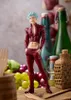 A figurine of Ban from The Seven Deadly Sins is displayed on a wooden surface with various food items and bottles in the background. Produktbild-Vorschau