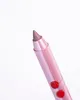 A close-up shot of a pink lip liner with cherry designs on a white background. Anteprima dell’immagine prodotto