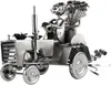 A metal sculpture of a wedding couple on a tractor. Produktbild-Vorschau