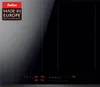 A top-down view of a black induction cooktop with a gray section on the left side. The cooktop has four heating zones and a digital display panel at the bottom. Produktbild-Vorschau