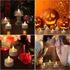 A collage of four images showing LED tea lights in different settings: on a table with festive decorations, around Halloween pumpkins, on a table with wine and a rose, and a couple kissing with tea lights in the foreground. Produktbild-Vorschau