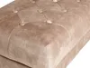 A close-up view of a tufted taupe velvet ottoman. Náhled obrázku produktu