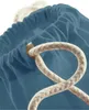 A close-up view of the top opening of a blue drawstring bag with a thick beige rope. Anteprima dell’immagine prodotto