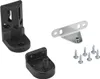 A collection of hardware components for mounting, including black plastic brackets and silver screws, arranged on a white background. Voir les images du produit