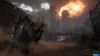 A soldier in a post-apocalyptic setting looks towards a massive explosion in the distance. Produktbild-Vorschau