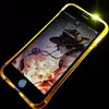 A smartphone with a glowing yellow case is displayed against a black background. The phone's screen shows a character from an anime. Produktbild-Vorschau