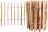 A close-up view of a wooden fence made of natural wood stakes bound together with wire. Produktbild-Vorschau