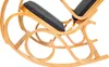 A close-up view of a wooden rocking chair with dark gray upholstery. Produktbild-Vorschau