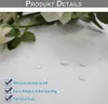 Close-up of a white fabric with water droplets, showing product features. Voir les images du produit