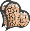 A heart-shaped metal firewood rack filled with logs, presented against a white background. Podgląd zdjęcia produktu