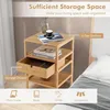 A bamboo nightstand with a drawer and shelves, placed next to a bed. The image highlights storage features and potential uses. Podgląd zdjęcia produktu