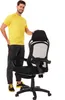 A man stands next to a black gaming chair. Produktbild-Vorschau