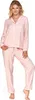 A woman is standing and posing in a pink pajama set. Produktbild-Vorschau