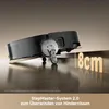 A robot vacuum cleaner is shown climbing over an 8cm obstacle, demonstrating its capability to overcome hindrances. Produktbild-Vorschau