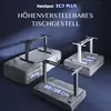 Three adjustable desk frames are displayed on stone-like pedestals against a dark blue background. Voir les images du produit
