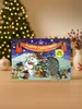 An advent calendar with a Christmas theme, featuring cartoon characters and decorations, is placed on a wooden surface in front of a blurred Christmas tree. Produktbild-Vorschau