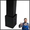 A close-up of a black metal corner bracket for a railing, with a man giving a thumbs up in the background. Anteprima dell’immagine prodotto