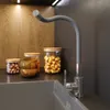 A kitchen sink area with a faucet and storage jars. Anteprima dell’immagine prodotto