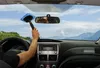View from inside a car, cleaning the windshield with a telescopic cleaner. Produktbild-Vorschau