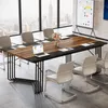 A modern conference room with a large wooden table and chairs, overlooking a city skyline. Podgląd zdjęcia produktu