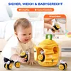 A baby playing with a plush beehive toy and bee plushies. Produktbild-Vorschau