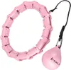 A pink hula hoop with a weighted ball attached by a string, shown on a white background. Podgląd zdjęcia produktu