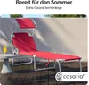 A red sun lounger with a canopy is set up on a wooden deck next to a small table with a drink. The background is a textured wall. Produktbild-Vorschau