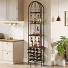 A tall, narrow wine rack with multiple shelves is placed in a kitchen or dining area, next to a cabinet and a potted plant. Náhľad obrázku produktu
